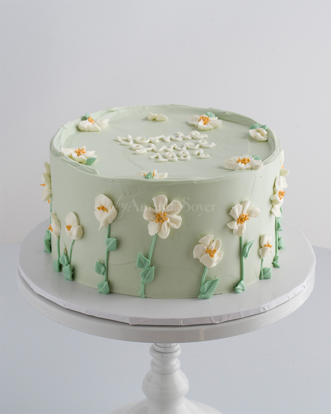 Sage cake with buttercream daisies