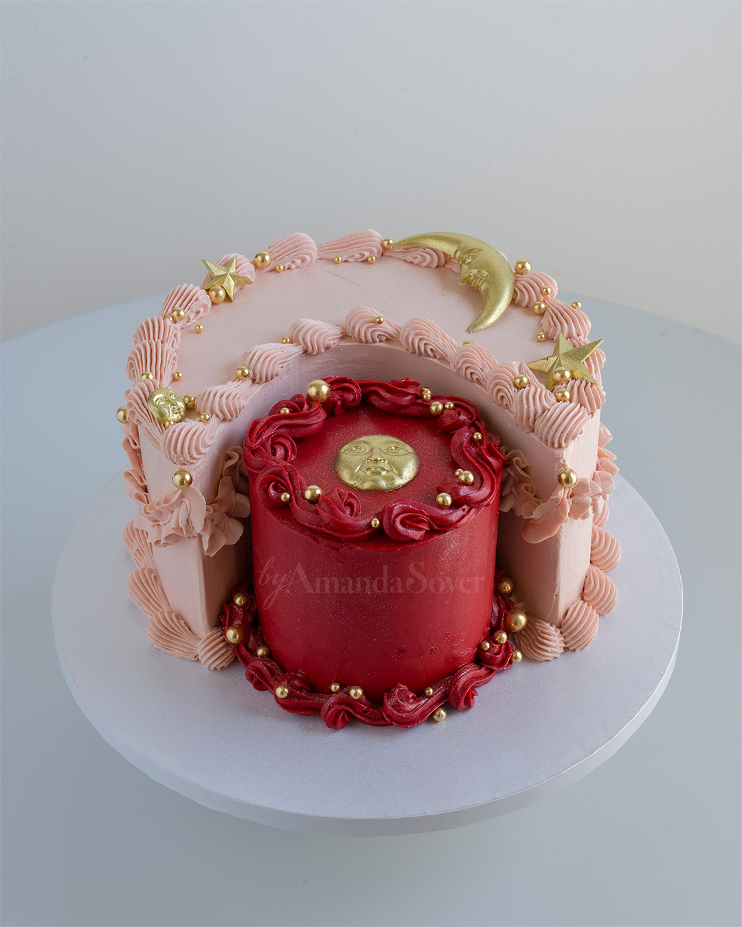 Pink cake with gold moon and stars